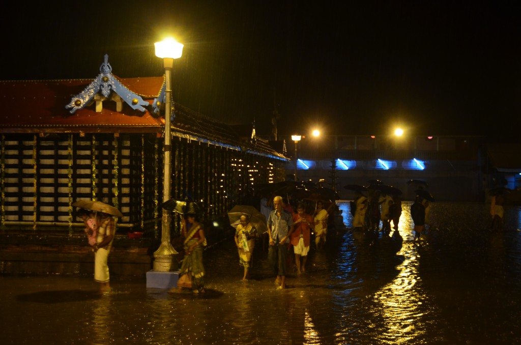 The pouring rain didn't stop a number of people from participating in one of the festival rituals--walking in circles around the temple--even though you can see the courtyard had flooded and was above people's ankles!