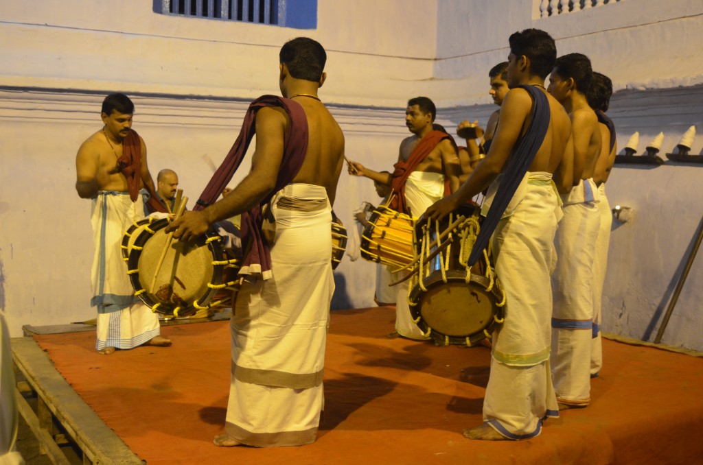 Drummers playing at the temple after the rain stops.