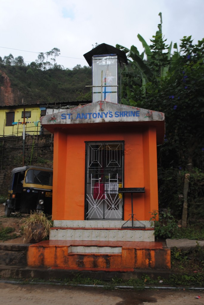 Christian shrine that typifies the Christian churches and other icons in Kerala. At the top is a statue of Mary and baby Jesus surrounded by a glass casing.