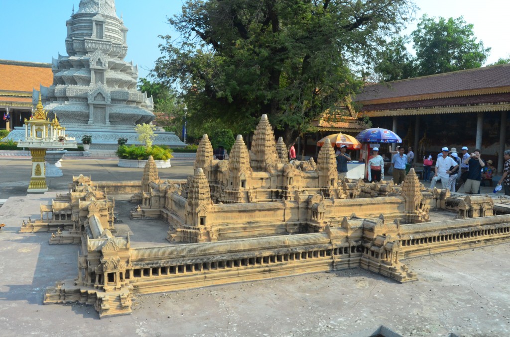 There is a detailed scale replica of Angkor Wat behind the pagoda.