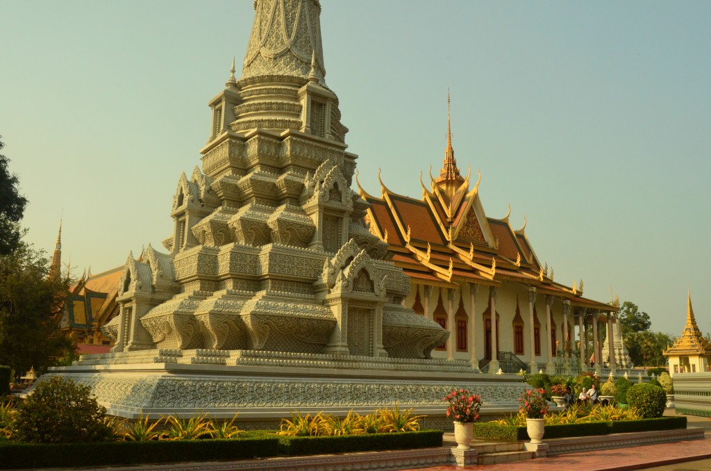 The pagoda is surrounded by smaller stupas.